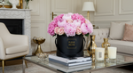 Flower box arrangement holding peonies, baby pink roses, and cotton candy pink hydrangeas